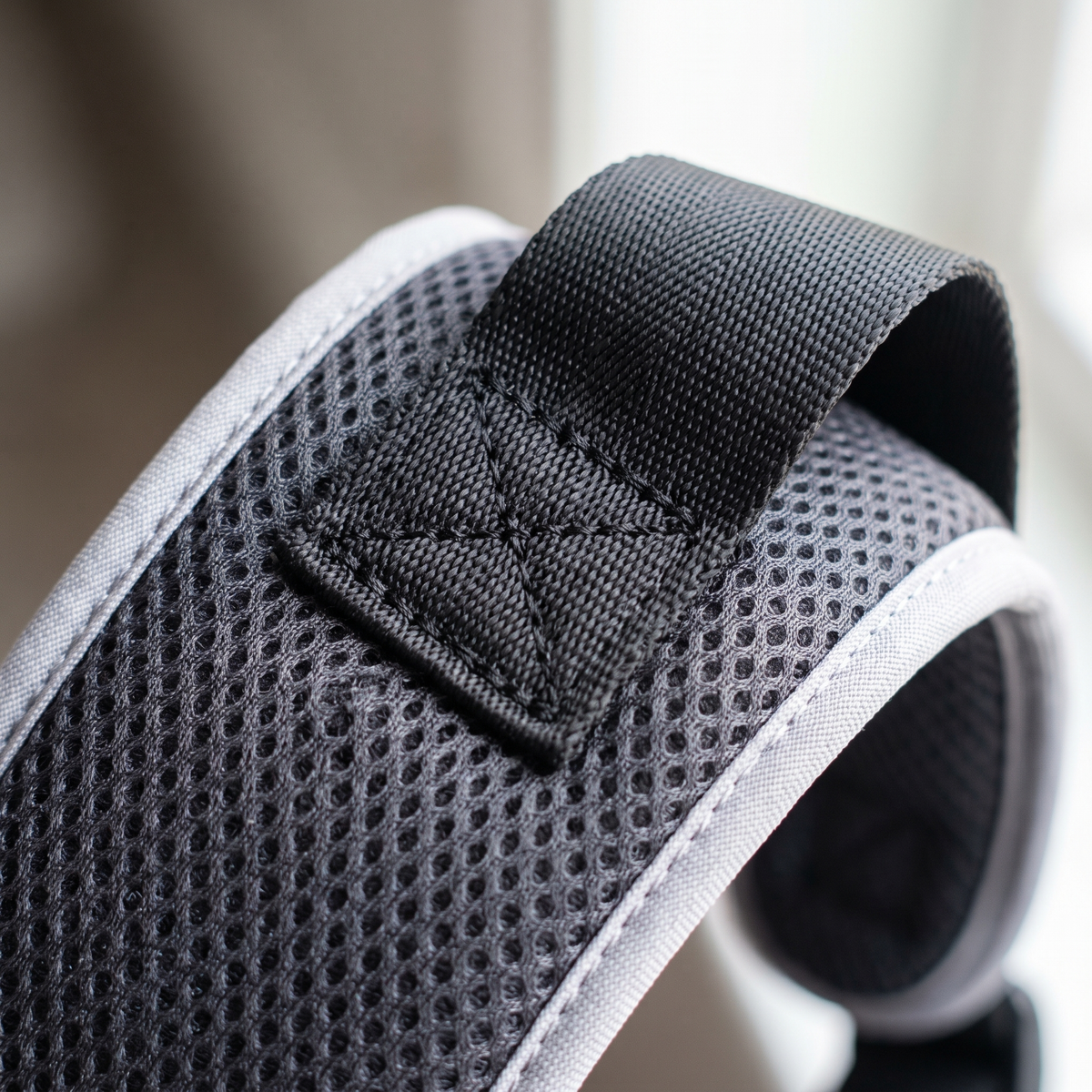 Stitching where the shoulder straps meet the pad, the load point that failed the recalled incumbent